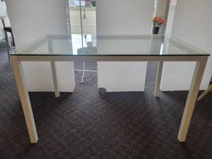 lot 86 image: Counter Height Glass Topped Table with Aluminum Legs by Johnston Casuals.