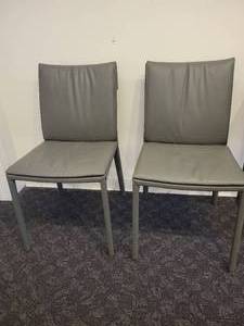 lot 118 image: A Pair of Leather Chairs by Cattelan.