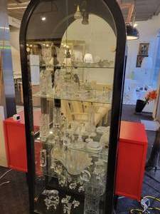lot 122 image: A Black Curved Top Display Case with all contents included.
