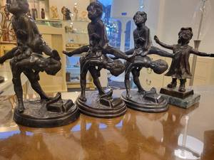 lot 133 image: A group of 4 Bronze Statues.  Children Leapfrogging and Blindfolded Girl.
