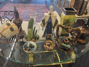 lot 148 image: A table full of Decor  Collectible Items. Painted Ostrich Egg, Oriental T-Pots, Vases, Decor etc.