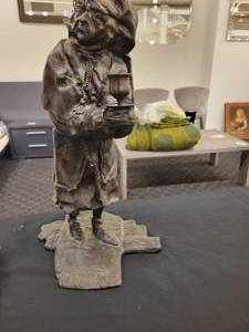 lot 160 image: A Bronze Statue of of Ebenezer Scrooge Candle Holder.