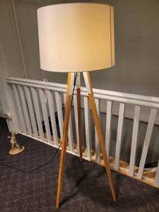 lot 172 image: A Tripod Floor Lamp with wood legs.