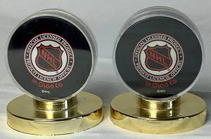 lot 158 image: Pair of Dallas Stars Autographed Hockey Pucks 2000 - Mike Keane #12, Guy Carbonneau #21, Brett Hull and Jamie Wright