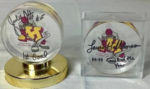 lot 166 image: Minnesota Gophers Womans Hockey Autographed Pucks - Julie Otto #15 First Goal in Programs History and Laura Haldorson 199798 Coach of the Year