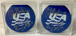 lot 167 image: USA Hockey Blue Pucks Autographed by Alana Blahok #18 and Karen Bye #6