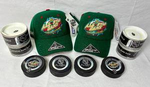 lot 97 image: 2004 NHL All Star Game Minnesota - 4 Official Game Pucks and Two Baseball Caps (new with tags)