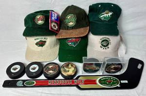lot 177 image: Minnesota Wild Bundle - Baseball Caps. Inaugural Season 20002001 Mini Goalie Stick, Hockey Pucks