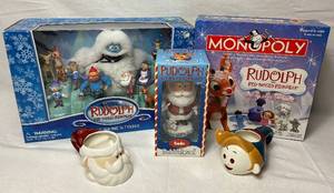 lot 216 image: Rudolph the Red Nosed Reindeer Humble Bumble & Friends Set plus Santa Bobblehead, Rudolph Monopoly and Santa & Hermey Mugs