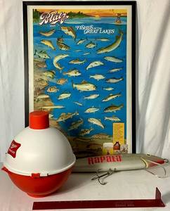 lot 208 image: Novelty Fishing Collection - Miller High Life Bobber Cooler 16 High, Blatz Bear Fishes of the Great Lakes 37.25 x 25.25, Rapala Giant Lure 28.5 and The Judge Tournament Rule up to 22