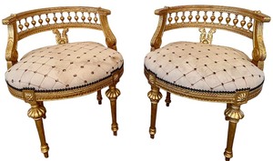lot 19 image: Pair Of Gilded French-Style Armchairs With Tufted Cream Upholstery #1