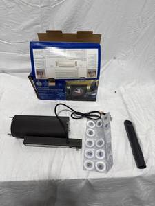 lot 0265 image: Year-Round Outdoor Projector