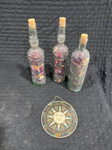 lot 0385 image: Decorative Bottles with Sun Ornament