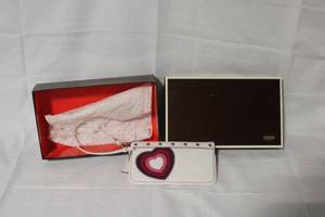 lot 12 image: Coach White Wristlet with Heart Design and Original Box