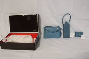 lot 22 image: Coach Blue Leather Wristlet, Phone Case, and Memo Holder Set with Box