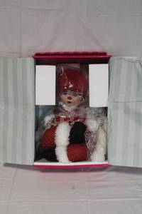 lot 34 image: Marie Osmond Fine Collectibles Huggas Mistle Ho Ho Ho Porcelain Doll in Box