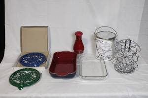 lot 180 image: Kitchenware Collection with Denby Baking Dish, Pyrex Dish, Cast Iron Trivets, KitchenAid Chopper, Lunch Pail, and Metal Cup Holder