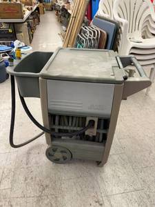 lot 22 image: Garden Hose in Rolling Cart