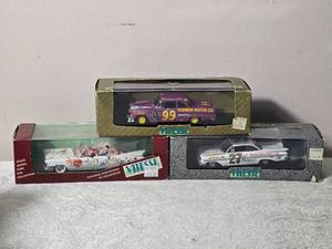 lot 201 image: Die Cast Model Cars - 143 - Vitesse - Cadillac Type 62 Just Married Convertible (1959)  Ford Fairlane NASCAR #99 Purple Hog Curtis Turner (1956)  Chevrolet Impala NASCAR #27 Junior Johnson Daytona (1959)