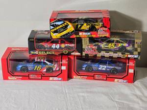 lot 153 image: NASCAR Die Cast Model Cars  124  Racing Champions  Revell  Family Channel #16 Musgrove (1994), Small Soldiers #44 Stewart (1998), Spree #45 Petty (1999), Maxwell House #22 Labonte (1991), DeWalt #17 Kenseth (1999)