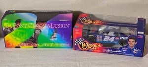 lot 152 image: NASCAR Die Cast Model Cars - 124 - Racing Champions  Action - Pepsi Chevrolet Monte Carlo #24  DuPont ChromaLusion Chevrolet Monte Carlo #24 Jeff Gordon