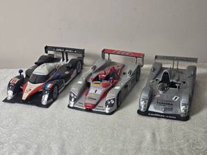 lot 102 image: Die Cast Model Cars - 118 - Hot Wheels - Cadillac Northstar LMP GMTM (2000)  Infineon Audi R8 Le Mans (2002)  Peugeot 908 Hdi FAP 