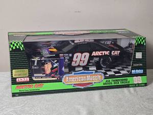 lot 79 image: NASCAR Die Cast Model Cars - 118 - American Muscle - Arctic Cat ASA Ford Thunderbird #99 Dick Trickle