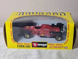 lot 72 image: Formula 1 Die Cast Model Cars - 124 - Burago - Ferrari F310 #1 Michael Schumacher (1996)