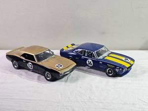 lot 75C image: GMP Precision Replicas 118  1968 Chevrolet Camaro Trans-Am Racers (Pair)  #13 BlackGold & #36 Penske BlueYellow