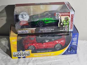 lot 55D image: 118 Die-Cast Corvette Duo  2009 Corvette ZR1 (Jada Bigtime Muscle) & 2016 Corvette Stingray Crosshairs Transformers Metals Die-Cast  Boxed Pair