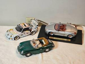lot 68D image: 118 Porsche Die-Cast Collection  Boxster  911 GT2 Nude Art Livery  356 Cabriolet  Lot of 3