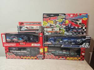 lot 201B image: Lot of NASCAR Racing Team Transporters  Racing Champions, Matchbox, Jimmie Johnson Lowes #48, 164 Scale