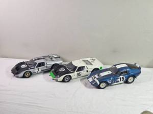 lot 104E image: 118 Die-Cast Racing Legends Trio  Shelby Cobra Daytona Coupe #15  Porsche 910 #95  Ford GT40 #7  Opening Panels & Detailed Engines