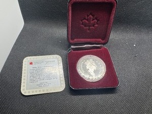 lot 67 image: 1991 Proof Canadian Commemorative Silver Dollar in Original Mint Box with COA