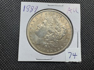 lot 74 image: 1889 Morgan Silver Dollar Marked AU When Purchased