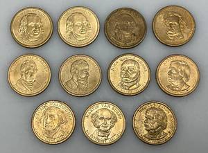 lot 27 image: 11 Misc. Presidential One Dollar Coins