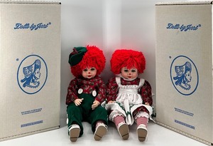 lot 174 image: Dolls by Jerri - Raggedy Jim and Raggedy Ann Christmas Porcelain Dolls with Original Boxes