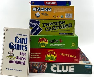 lot 195 image: Board Games Lot - Skip-Bo, Rack-O, Reverse Charades, Apples to Apples & Clue