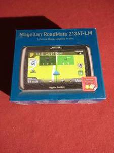 lot 104 image: (2) GPS Units - Garmin Nuvi & Magellan
