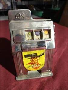 lot 107 image: Vintage 1950s Rexco Slot Machine Bank