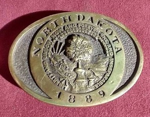 lot 337 image: 1979 Brass North Dakota Belt Buckle