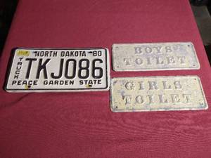 lot 373 image: Vintage ND License Plate & (2) Metal Bathroom Signs