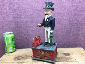 lot 103 image: Cast Iron - Uncle Sam - Mechanical Bank - Neat