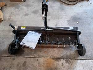 lot 2 image: Tow Behind Lawn Dethatcher with Steel Frame and Manual