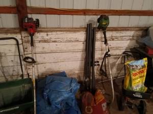 lot 52 image: Group of Lawn Care Tools with Spreaders, Trimmers, Tarps, and Supplies