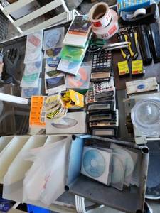 lot 118 image: Lot of Office Supplies and Media Including Calculators, Label Rolls, CDs, and More