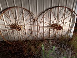 lot 1112 image: Pair of Large Antique Metal Wagon Wheels with Spokes