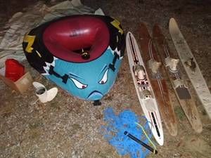 lot 70 image: Boat Accessory Lot with Inflatable Towable, Water Skis, Propeller, and Gas Can
