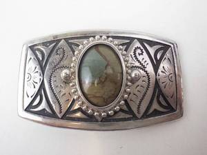 lot 17 image: Southwestern Silver Belt Buckle with Oval Stone Inset - NavajoZuni-Inspired Motif