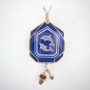 lot 170 image: Dolphin Pendant on Blue Octagonal Stone - Gold Wire-Wrap with Bucket & Shovel Charms